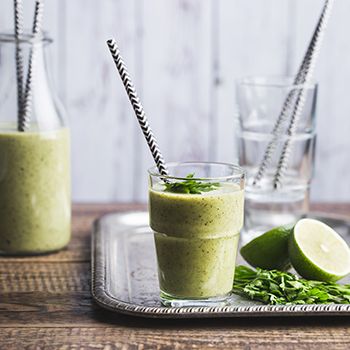 Green smoothie with kiwi, avocado and parsley